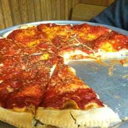 Craig's Pizza House - Yummy stuffed with Italian sausage, cheese, onions, and green peppers. Crispy and good.