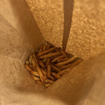Five Guys - a paper bag filled with french fries - Burgers Near Me - Leland, North Carolina