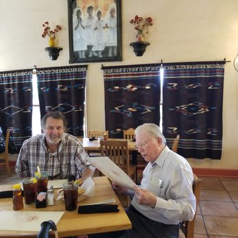 Teofilos Restaurante - The first communion painting brought back memories of living in Spain, but with a Latino flavor. - New Mexican Cuisine Near Me - Los Lunas, New Mexico