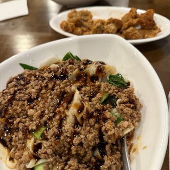 Dolphin Bay - Popcorn chicken (back) and spicy wonton noodles - Taiwanese Near Me - Boston, Massachusetts Dolphin Bay - Popcorn chicken (back) and spicy wonton noodles - Taiwanese Near Me - Boston, Massachusetts