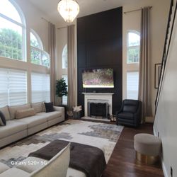 Legacy Home Renovation & Repair - Accent wall installed enhances 18 foot living room ceilings and creates wonderful conversation piece to this beautiful home.