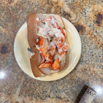 Bag O Crab - This is the entire sandwich. You could see how tiny it is next to a cork of a bottle of wine. - Seafood Near Me - Escondido, California