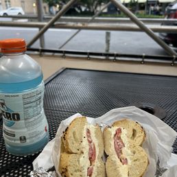 Garlic bagel with cream cheese and tomato Garlic bagel with cream cheese and tomato