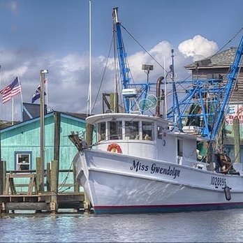 Fish Peddler Seafood - a fishing boat docked at a dock - Seafood Markets Near Me - Supply, North Carolina