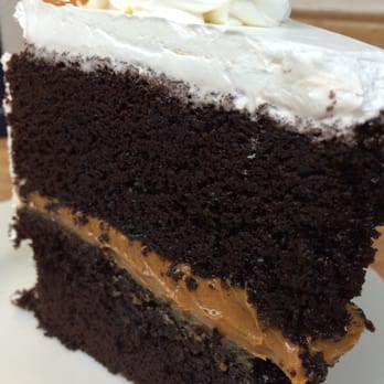 Nilda's Party Creations - Large slice of chocolate cake with dulce de leche filling. - Bakeries Near Me - Midtown, Alaska Nilda's Party Creations - Large slice of chocolate cake with dulce de leche filling. - Bakeries Near Me - Midtown, Alaska