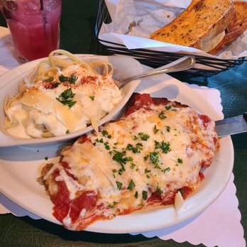 Uncle Primo's - Fresh Garlic Bread, Chicken Parmesan, and a side of Fettuccine Alfredo. - Italian Near Me - New Philadelphia, Ohio Uncle Primo's - Fresh Garlic Bread, Chicken Parmesan, and a side of Fettuccine Alfredo. - Italian Near Me - New Philadelphia, Ohio