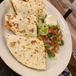Steak and Chicken Quesadilla from the A La Carte Menu served with fresh Pico de Gallo, and sour cream