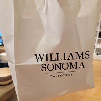 Williams-Sonoma - a white shopping bag with the williams sonoma logo on it - Kitchen & Bath Near Me - Houston, Texas