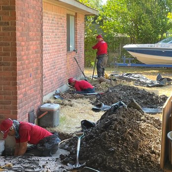 CenTex Foundation Repair - The guys hard at it with lawn protection in place! - Foundation Repair Near Me - Austin, Texas