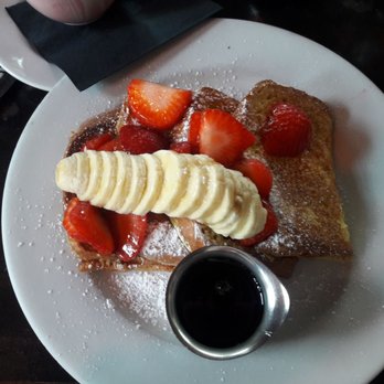Blue Daisy - French toast served with bananas and strawberries with powdered sugar. - Creperies Near Me - Santa Monica, California Blue Daisy - French toast served with bananas and strawberries with powdered sugar. - Creperies Near Me - Santa Monica, California