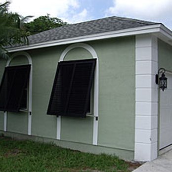 Accurate Doors And Shutters - Bahama style impact shutters keep your home safe while maintaining a tropical aesthetic! Perfect for homes on the beach! - Shutters Near Me - Melbourne, Florida Accurate Doors And Shutters - Bahama style impact shutters keep your home safe while maintaining a tropical aesthetic! Perfect for homes on the beach! - Shutters Near Me - Melbourne, Florida