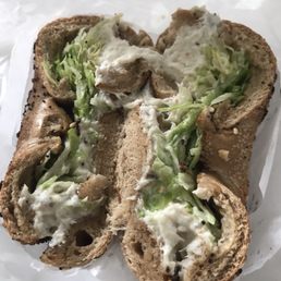 Whitefish with lettuce on whole wheat everything bagel