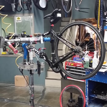 Two Wheels One Planet - Lucy getting worked on to fix her rim and get grip installed. - Bikes Near Me - Costa Mesa, California