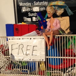 Show Love Thrift - Shelf of free toys out front