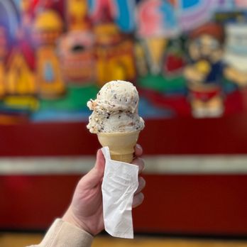Babe's Ice Cream - a hand holding an ice cream cone - Ice Cream & Frozen Yogurt Near Me - Milwaukee, Wisconsin Babe's Ice Cream - a hand holding an ice cream cone - Ice Cream & Frozen Yogurt Near Me - Milwaukee, Wisconsin