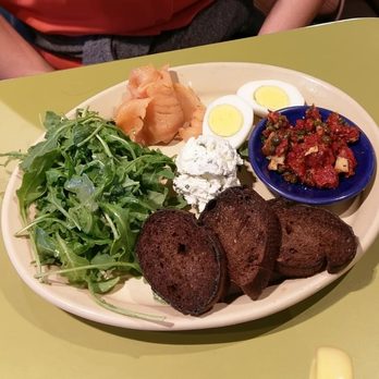 Snooze, an A.M. Eatery - Lower east side plate, sMoked salmon, arugula, boiled egg, capers, chocolate baguette toast - Breakfast & Brunch Near Me - Addison, Texas
