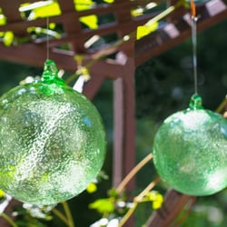 Botanicals - Glow in the dark luminescent crystals inside the glass sphere absorb light energy during the day & glow at night!