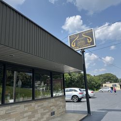 Baylee Thai Cuisine - Parking lot sign