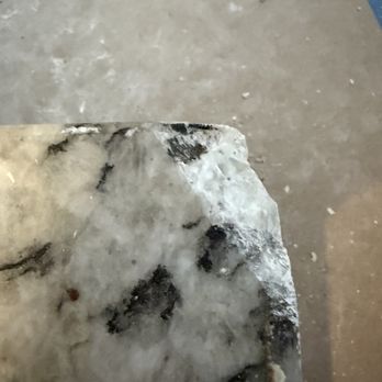 Green Planet Restoration of Orange County - This photo demonstrates that the broken granite was not repairable and required replacement of all four slabs due to the inability to obtain - Damage Restoration Near Me - Irvine, California
