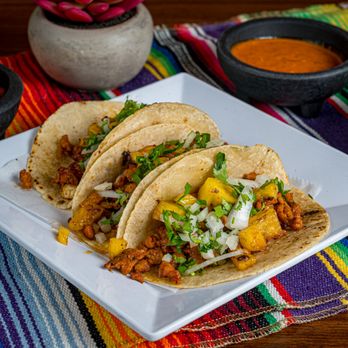 TBK Grill - Authentic tacos al pastor topped with pineapple, cilantro, and onion - a traditional Mexican favorite served on handmade corn tortillas. - Food Trucks Near Me - Homestead, Florida TBK Grill - Authentic tacos al pastor topped with pineapple, cilantro, and onion - a traditional Mexican favorite served on handmade corn tortillas. - Food Trucks Near Me - Homestead, Florida