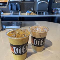 Left is golden milk latte (not the best, it's almost like drinking cold curry)  Right is a classic iced caramel oat latte