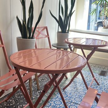 Little Rico - a table and chairs in front of a window - Health Markets Near Me - Hudson, New York