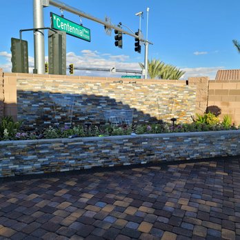 Aliante Landscape - a brick wall and a street sign - Landscaping Near Me Aliante Landscape - a brick wall and a street sign - Landscaping Near Me