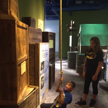 SPAM Museum - Hoisting cans of spam - Museums Near Me - Austin, Minnesota
