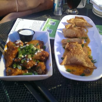 The Local - Sriracha wings on left and The Local`s wontons on right. Both fantastic! - Irish Pub Near Me - Minneapolis, Minnesota The Local - Sriracha wings on left and The Local`s wontons on right. Both fantastic! - Irish Pub Near Me - Minneapolis, Minnesota