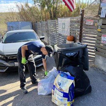 Junk Punch Junk Removal - Cleaning out a customers overflowing trash bin. - Junk Removal & Hauling Near Me - Chula Vista, California
