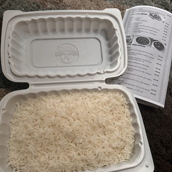 Mumbai Grand - rice in a styrofoam container and a recipe book - Indian Near Me - Auburn, Washington Mumbai Grand - rice in a styrofoam container and a recipe book - Indian Near Me - Auburn, Washington