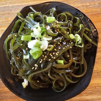 Yunshang Rice Noodle - a black plate with noodles and green onions - Noodles Near Me - Markham, Ontario Yunshang Rice Noodle - a black plate with noodles and green onions - Noodles Near Me - Markham, Ontario