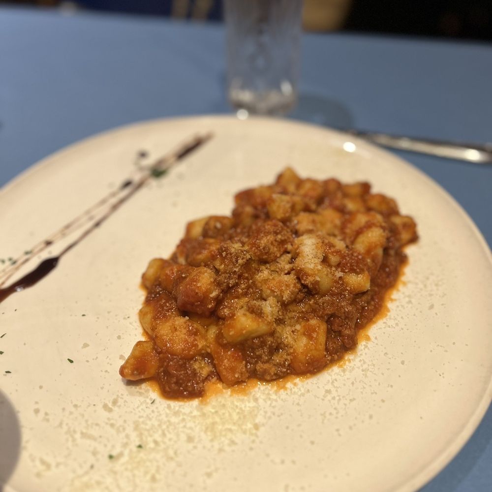 Parma - a plate of pasta and a glass of water - Italian Near Me - Fresno, California Parma - a plate of pasta and a glass of water - Italian Near Me - Fresno, California