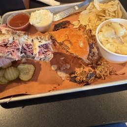Pulled pork and Reuben, pickles, potato salad, coleslaw and chips.