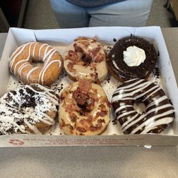 The Boardwalk, (2) Maple Bacon, New York Cheesecake, Oreo cookie, and one specially created with powdered sugar