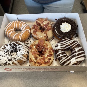 Duck Donuts - Marietta - The Boardwalk, (2) Maple Bacon, New York Cheesecake, Oreo cookie, and one specially created with powdered sugar - Donuts Near Me - Marietta, Georgia