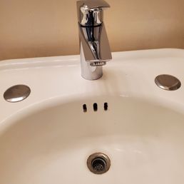 New bathroom faucet replacing one with antiquated plastic dual faucet controls. New bathroom faucet replacing one with antiquated plastic dual faucet controls.
