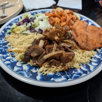 Kalsan Cuisine - Platter for 3-4 with goat, chicken & fish - African Near Me - St Cloud, Minnesota Kalsan Cuisine - Platter for 3-4 with goat, chicken & fish - African Near Me - St Cloud, Minnesota