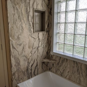 Re-Bath - a white bathtub in a bathroom - General Contractors Near Me - Richardson, Texas Re-Bath - a white bathtub in a bathroom - General Contractors Near Me - Richardson, Texas