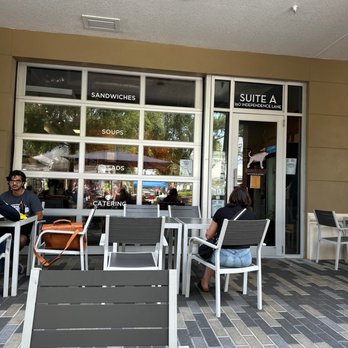 Houndstooth Kitchen & Eatery - two people sitting outside of a restaurant - Salad Near Me - Maitland, Florida Houndstooth Kitchen & Eatery - two people sitting outside of a restaurant - Salad Near Me - Maitland, Florida