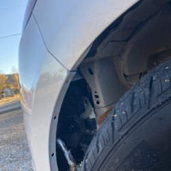 Larry H Miller Collision Centers - Wheel well cover missing