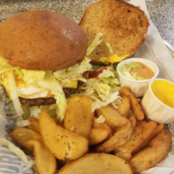 Fuddruckers - 1/2 LB Beef with egg and American cheese. More cooked than I asked, but tasty. Whole wheat bun was way on point. - Burgers Near Me - Greenville, South Carolina
