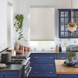 Fashion Interiors - Custom faux wood blinds installation for modern casual kitchen.