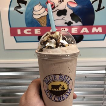 MooTown - a hand holding a cup of ice cream - Ice Cream & Frozen Yogurt Near Me - Sunset Beach, North Carolina MooTown - a hand holding a cup of ice cream - Ice Cream & Frozen Yogurt Near Me - Sunset Beach, North Carolina