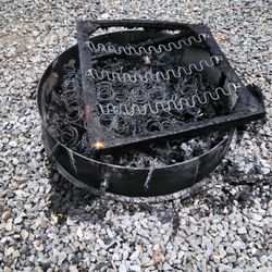 Webster K O A Family Kampground - This is how the same camper tried to dispose of the furniture they didn't want.  Two fire pits like this.