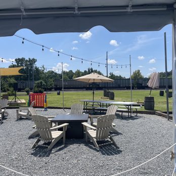 Afterglow Brewing - tables and chairs under a tent - Breweries Near Me - Norfolk, Virginia