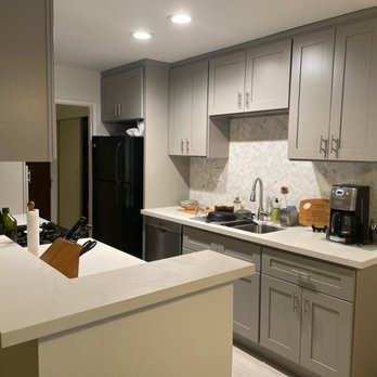Built Well Restoration & Construction - After! New cabinets, marble backsplash and quartz countertops - Damage Restoration Near Me