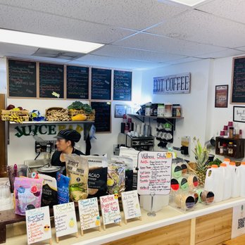 Boost E&V Juice Bar - a woman standing behind the counter - Juice Bars & Smoothies Near Me - Hallandale Beach, Florida Boost E&V Juice Bar - a woman standing behind the counter - Juice Bars & Smoothies Near Me - Hallandale Beach, Florida