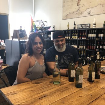 Wine & Corks - a man and a woman sitting at a table - Wine Bars Near Me - Orlando, Florida Wine & Corks - a man and a woman sitting at a table - Wine Bars Near Me - Orlando, Florida
