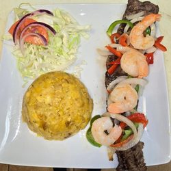 Ajo Y Oregano Latín Restaurant - Steak with shrimp and fried mashed plantains